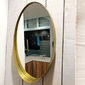 Miroir ovale en métal couleur or 61,5x37,5cm